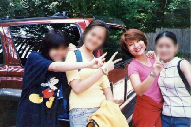Shandra and three other trafficking victims near a brothel in Connecticut. They were told to pose.