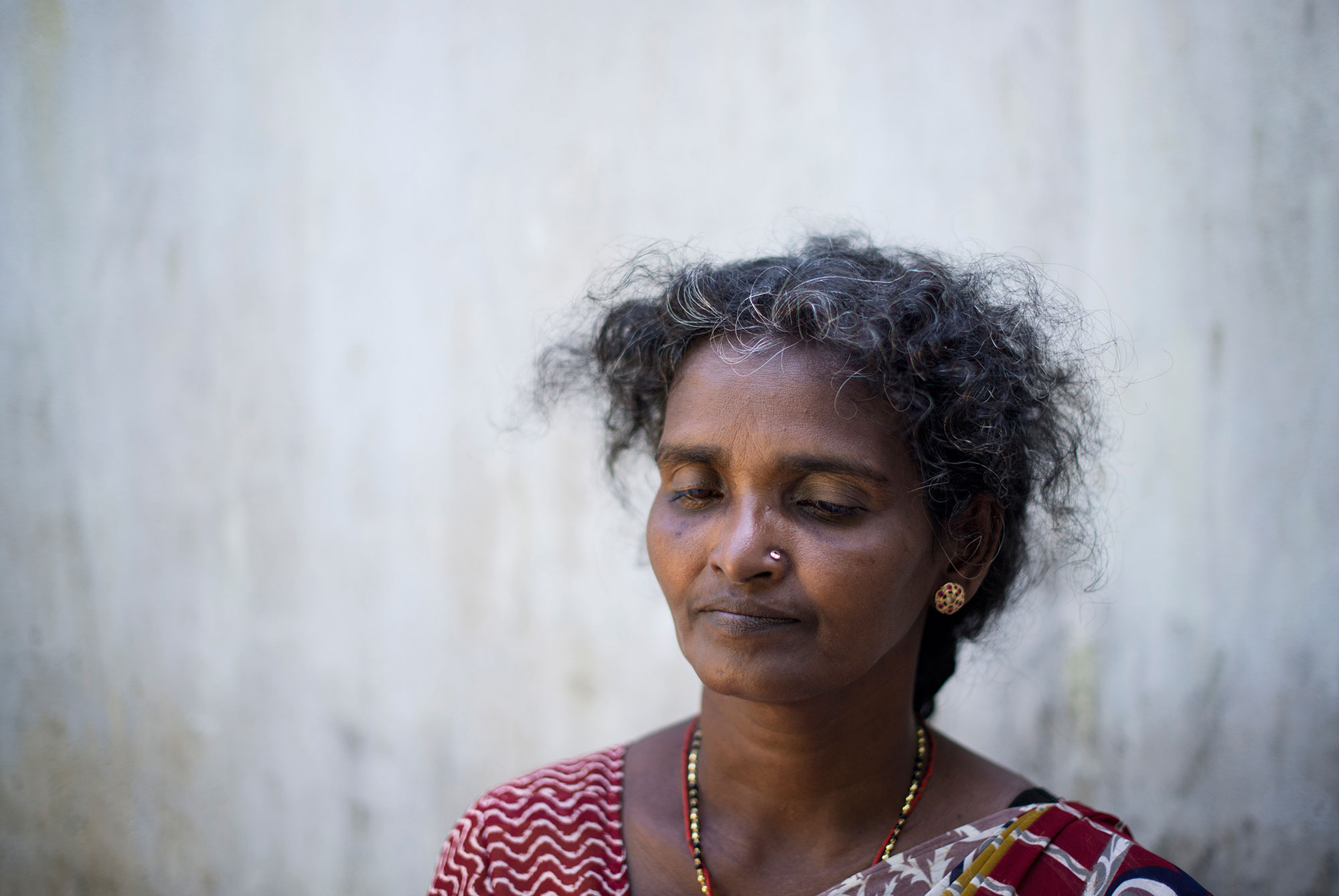 'In the last weeks of the war, my family had been dispersed, but on May 14, 2009, we all managed to get together in the 'safe zone' the army had established in Mullivaikal. They said civilians wouldn't be harmed there, so we found shelter in a small house ... We were happy to be together at last. But that same night, the building was shelled ... My husband was lying on the ground and, when I turned him around, I saw his chest open. He was dead. Next to him was my oldest daughter. She was holding her intestines in her hands, sure that she was going to die,' remembers Balasubramaniam Annaludchumy, who lost five members of her family that night. 