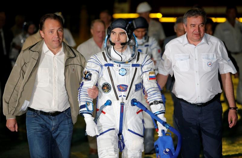 The International Space Station (ISS) crew member Anatoly Ivanishin of Russia walks to the rocket prior the launch at the Baikonur cosmodrome, Kazakhstan, July 7, 2016. REUTERS/Dmitri Lovertsky/POOL?