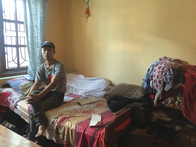 Rakesh Tamang, 33, in his rented room in Gongabu. He became jobless after his taxi was burnt by Maoists enforcing a strike last year. Both Khatri and Tamang are deep in debt and have received no compensation.