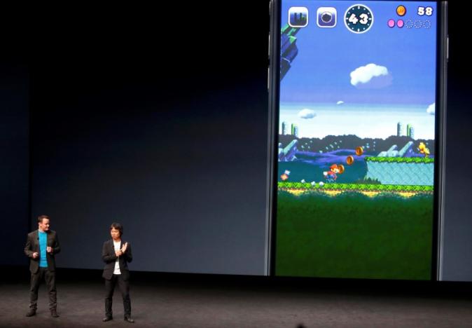 Nintendo Creative Fellow Shigeru Miyamoto announces a Mario Bros game for the iPhone, as a translator stands nearby, during an Apple media event in San Francisco, California, U.S. September 7, 2016. REUTERS/Beck Diefenbach
