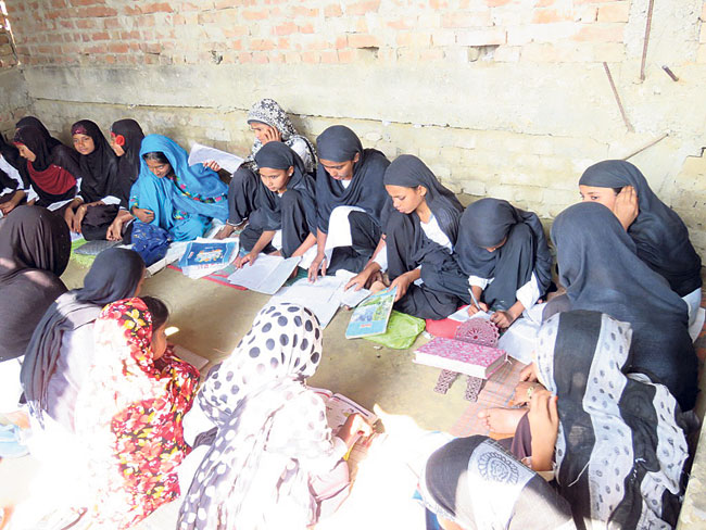 Students studying in a classroom of Jamiya Khadijatul Kubra Muslim Girls School in Farhadwa VDC, Rautahat in this recent picture. 
