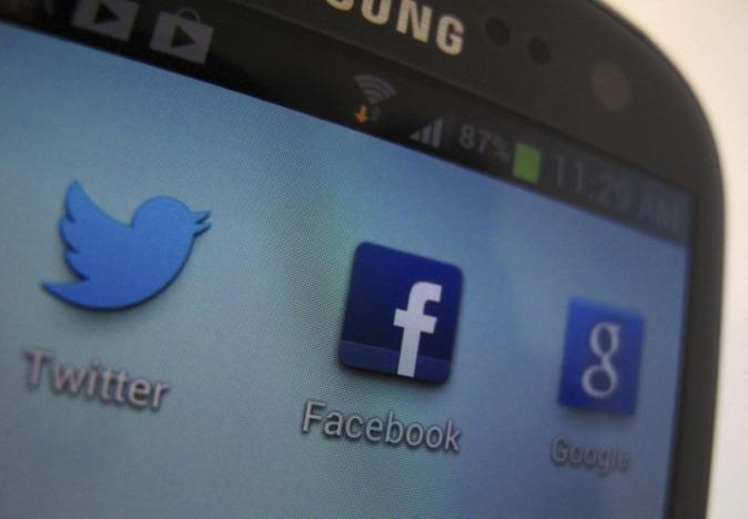 A Facebook icon is shown on a Samsung Galaxy III mobile phone in this photo illustration in Encinitas, California, January 30, 2013.  REUTERS/Mike Blake