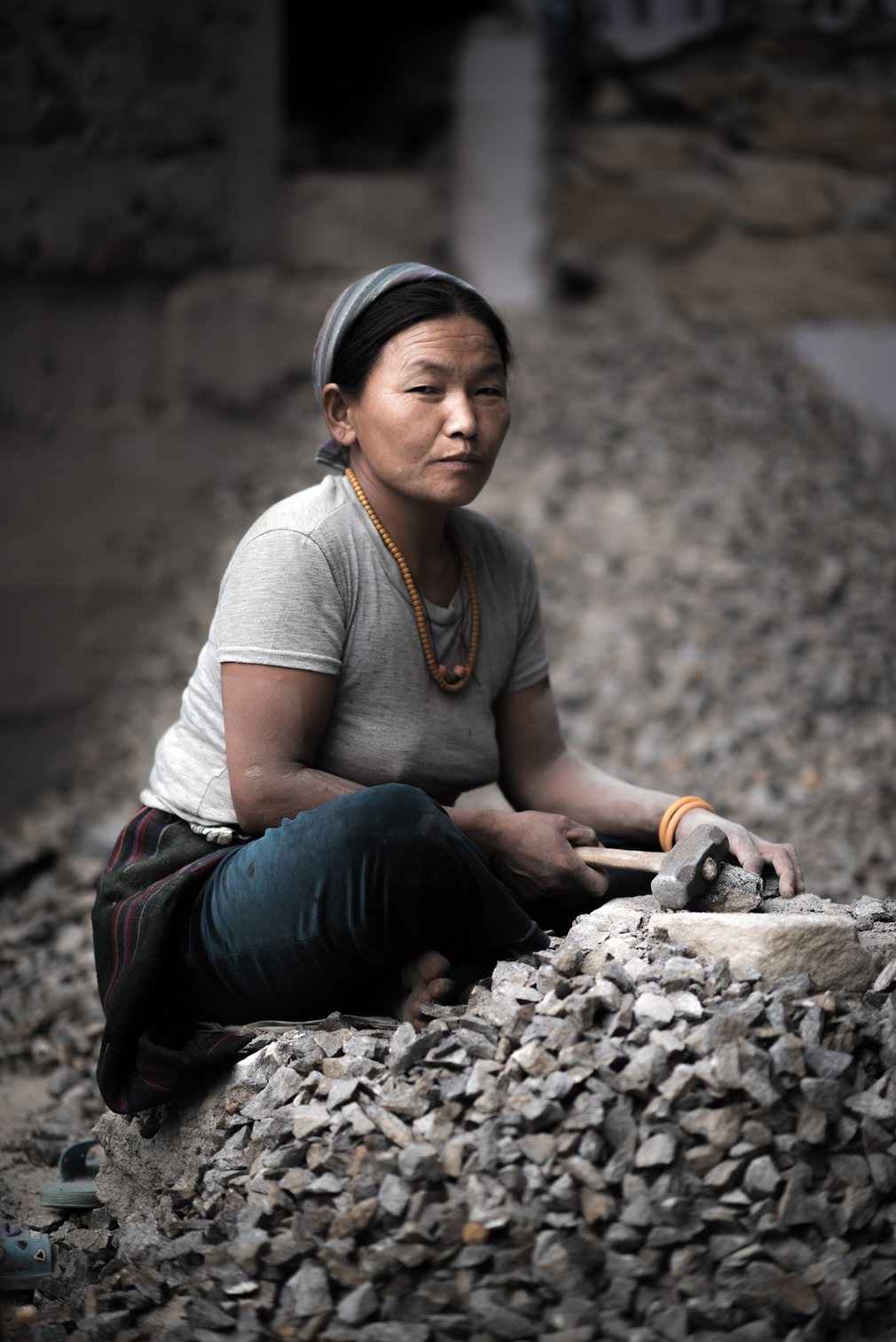 Surrounded by shingle, Chhiring begins the task of rebuilding her house in Thulo Shyaphru