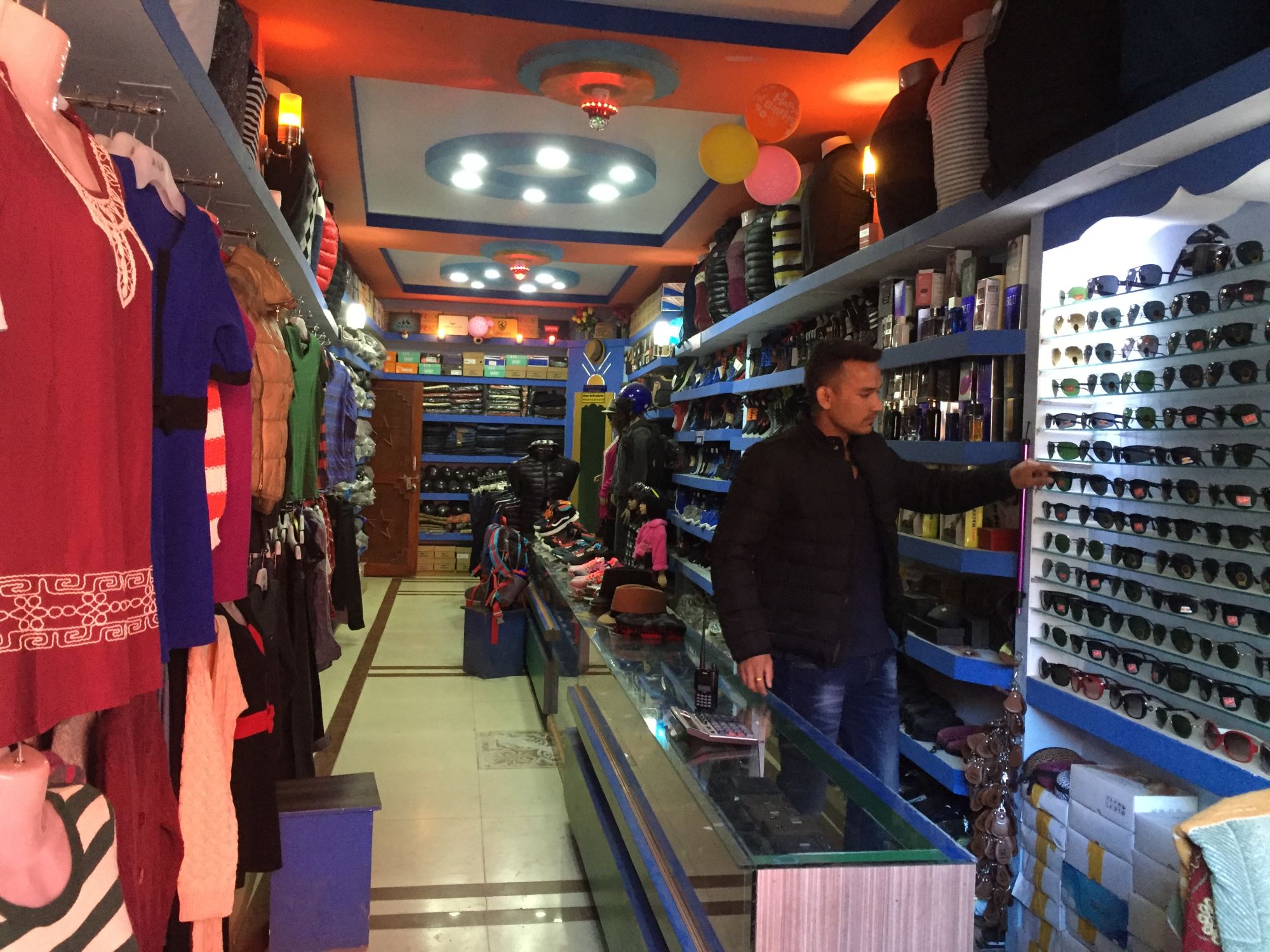 Dipak Bikram Shahi sells designer clothing and branded accessories in Jumla.