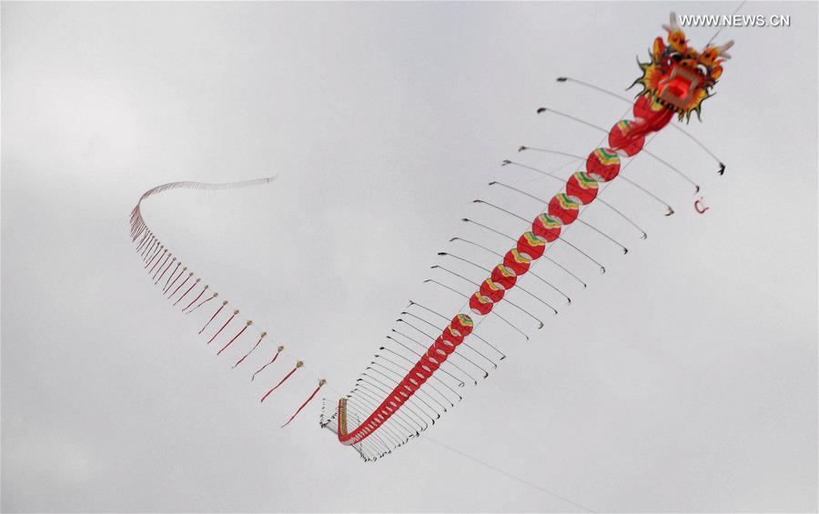 A 2016-meter long kite is seen during a kite fair in Qinzhou, south China's Guangxi Zhuang Autonomous Region, Dec. 3, 2016. Kites-flying fans from China and abroad took part in the fair on Saturday.