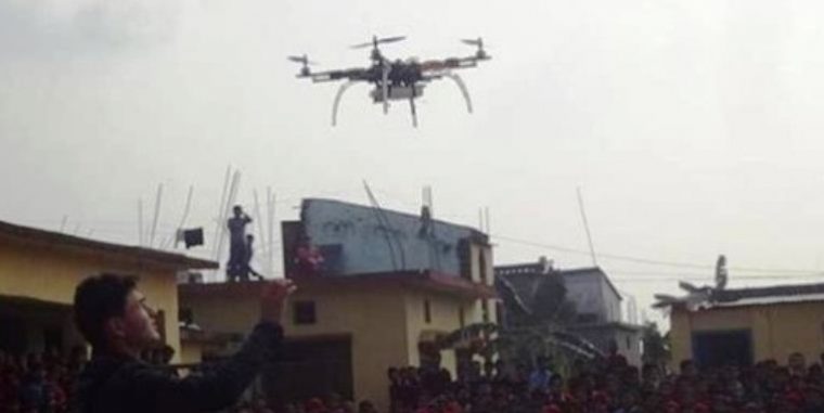 Students demonstrate remote controlled aeroplane in Tokha